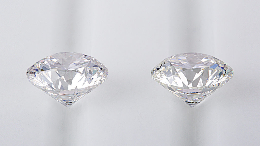 the side view of a mined diamond next to a lab grown diamond