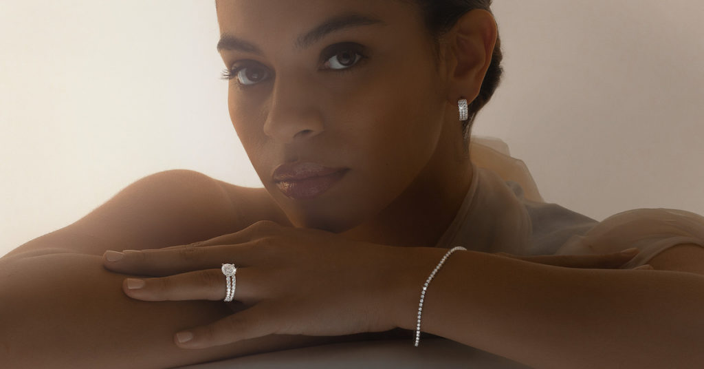 female model posing with a diamond ring and bracelet