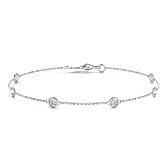 “Half carat diamond station bracelet with spaced lab-grown diamonds on a delicate chain.”