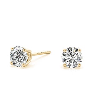 Round diamond stud earrings in yellow gold