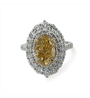 5 1/4 ct. tw. Oval Fancy Yellow Halo Engagemen Ring in 14K White and Yellow Gold
